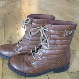 Brown combat boots with tan lacing